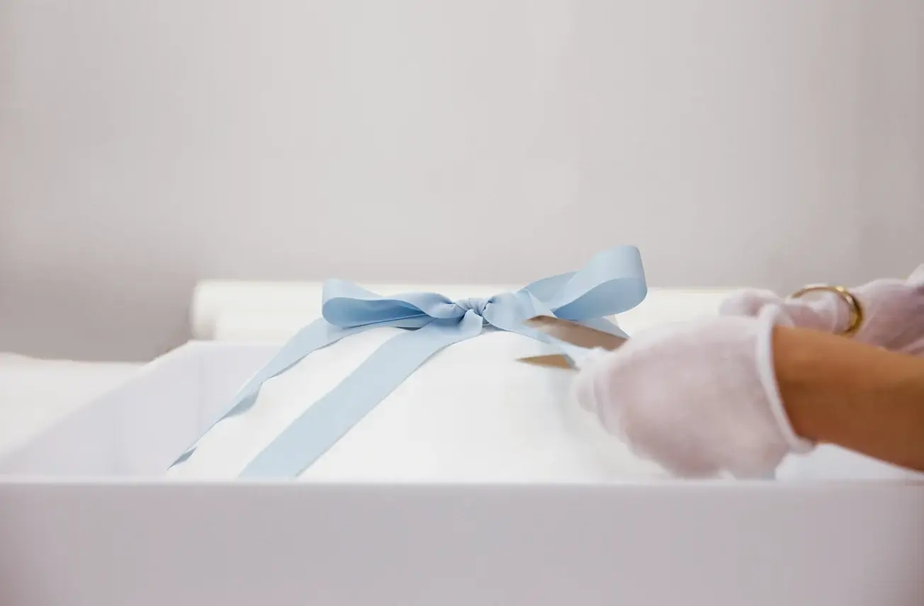 folding a blue ribbon